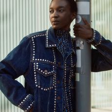 Girl posing in studded denim jacket