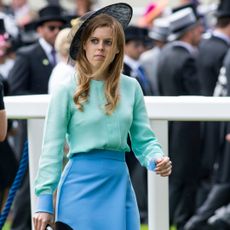 Princess Beatrice leaving an event in a colorblock turquoise and leather outfit